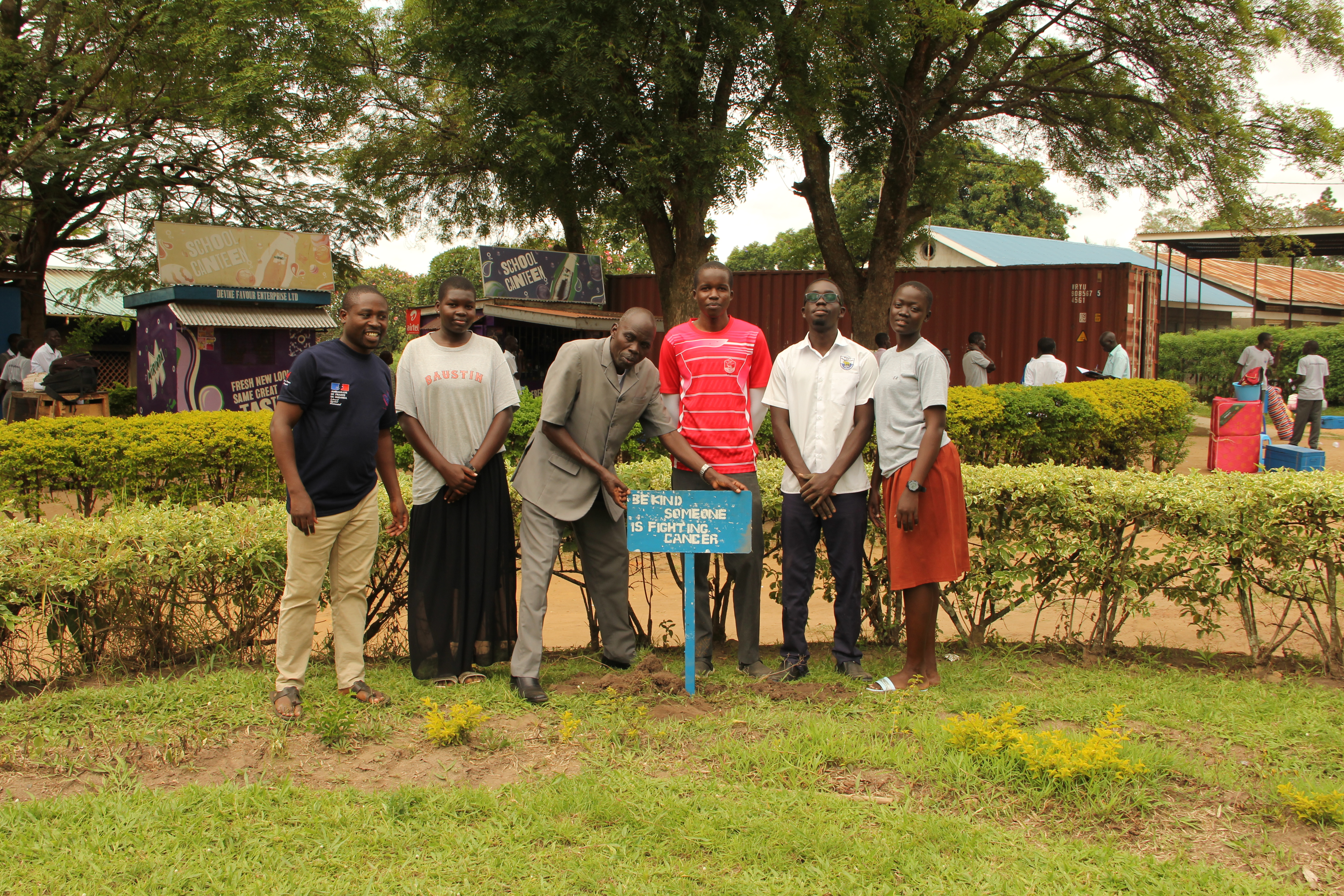 3C Club members pose for a photo with the Head Teacher